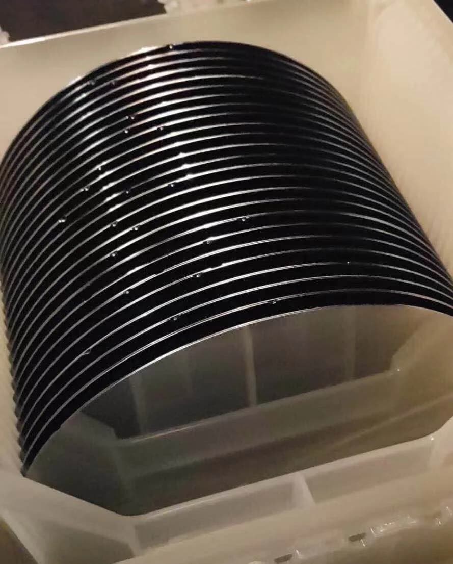 Stacked silicon wafers in a precision carrier